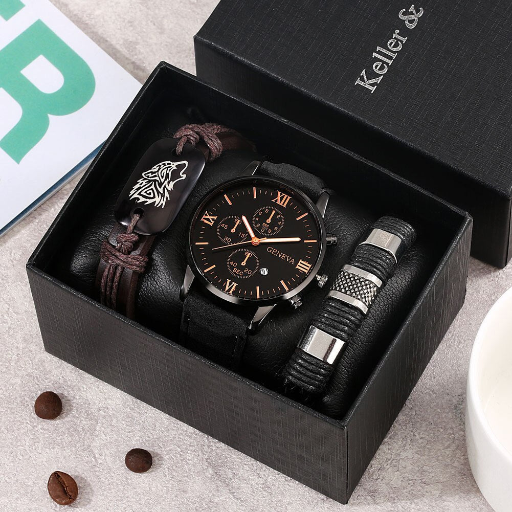 A men's wristwatch gift set in an open black presentation box, featuring a black leather strap chronograph watch with a black dial, a brown leather bracelet with a wolf emblem, and a black-and-silver textured bangle. 