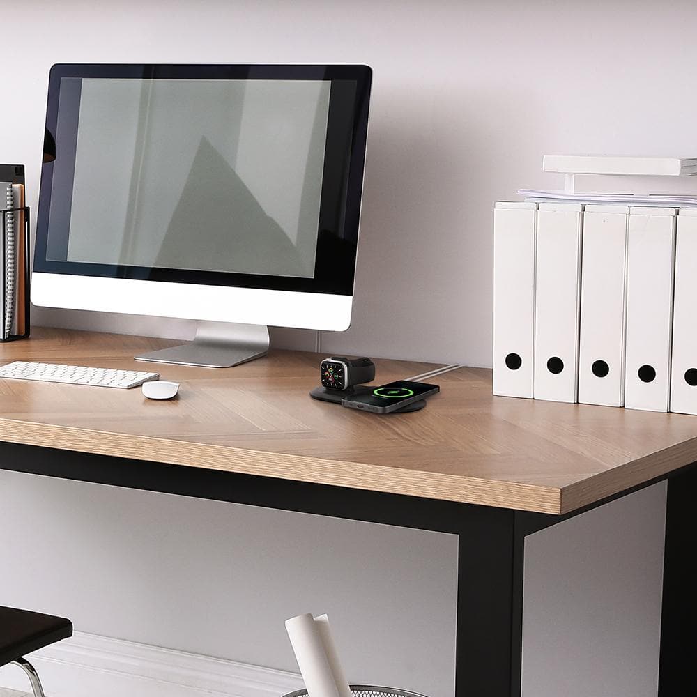 Mag Fit Duo in black showing Apple Watch and iPhone charging on top of computer desk