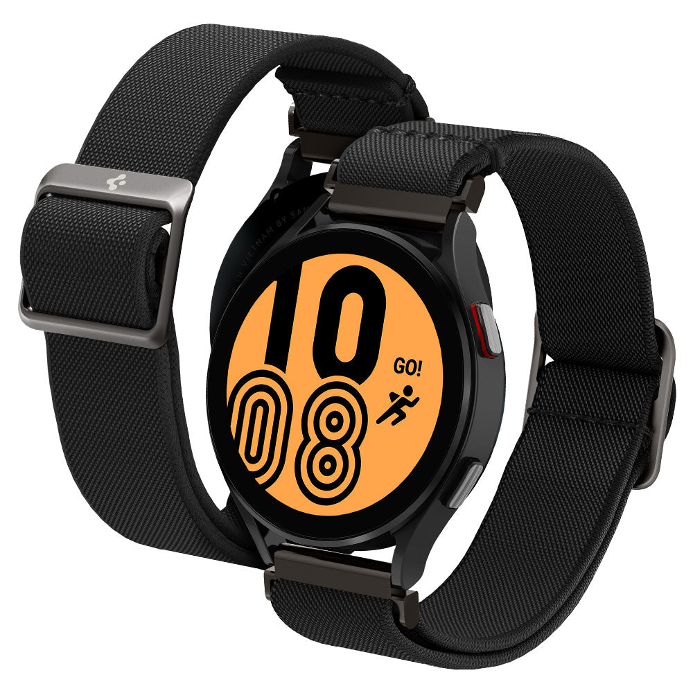 A black smartwatch with a textured black fabric strap, shown at an angle on a solid white background. The watch face is illuminated with an orange digital display showing the time as 10:08.
